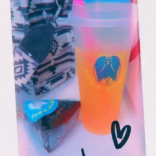 a plastic cup with a drink in it
