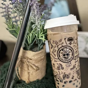 a coffee cup with a straw and a straw