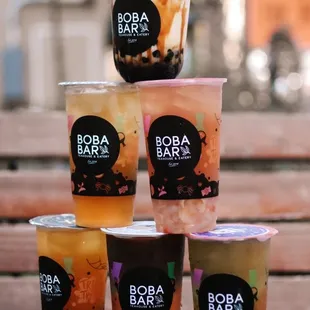 a stack of boba cups on a table
