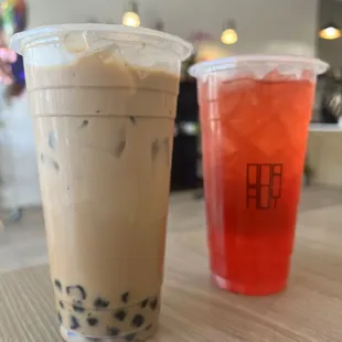 Hokkaido milk tea with honey boba and strawberry tea with popping boba