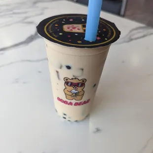 a boba cup with a blue straw