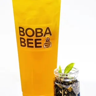 a glass of tea and a jar of tea