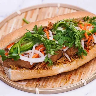 a sub sandwich with meat and vegetables