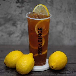 a glass of iced tea and lemons