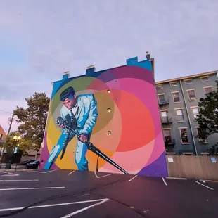 a mural of a man holding a gun
