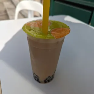 a plastic cup with a drink in it