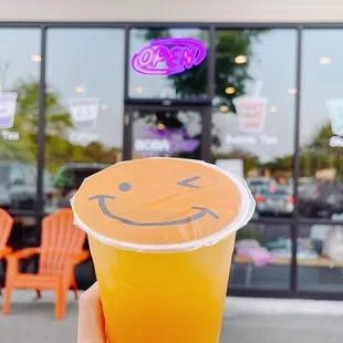 Passion fruit green tea with mango popping boba