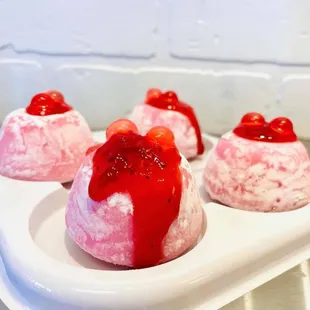 Mochi like you've never had before! Strawberry ice cream wrapped squishy mochi dough with juicy strawberry popping boba...