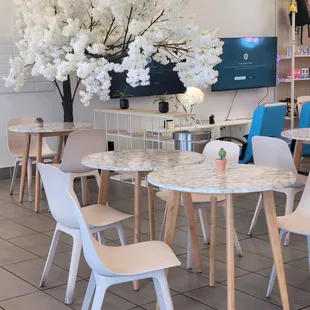 a table and chairs in a cafe