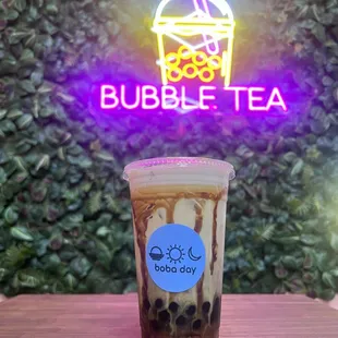 Jasmine Milk Tea with strawberry popping boba and regular boba