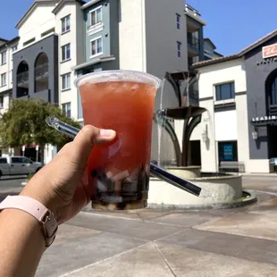 Boba and a view. Cheers to the boba gods! This was delicious! Strawberry Mango Green Tea with Lychee jelly and boba