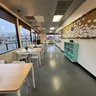 a long room with tables and chairs