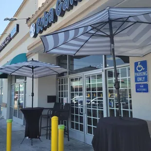 outside of restaurant with tables and umbrellas