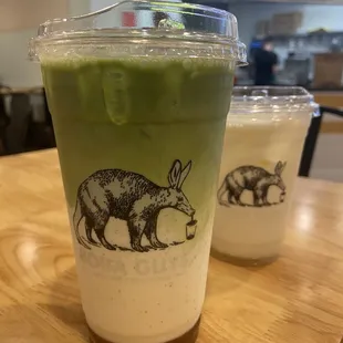 Matcha latte 24oz (left)  Pineapple Field 16oz (right)