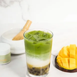 Mango Matcha Latte, organic premium-grade matcha from Tea People layered over your choice of milk and housemade mango purée.