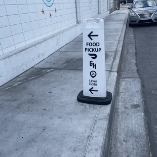 a sign on the side of a street