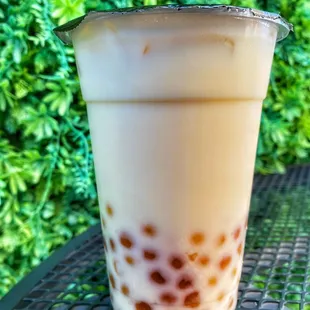 Peach mango milk tea with boba