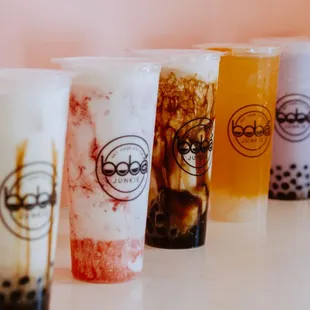 a row of boba drinks
