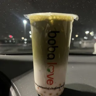 Iced Matcha Milk Tea with peach popping boba