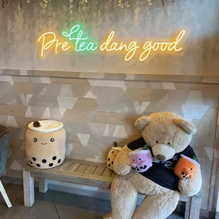 a teddy bear sitting on a bench