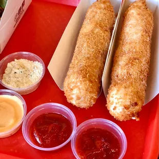 Korean hot dogs: one with hot dog only and one with mozzarella cheese only.