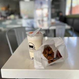 a cup of coffee and fried chicken