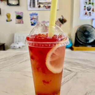 Tropical sunrise ~~lemonade mango pineapple with strawberry popping