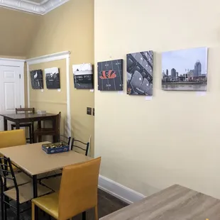 Custom art by local artist. Subject include Bengals, Reds, barns, etc. Artwork will rotate in time.