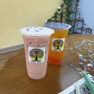 Rose boba tea and the jasmine orange boba tea on the puzzle table!