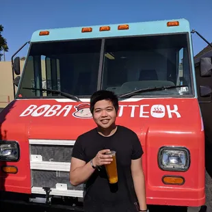 a man standing in front of a truck