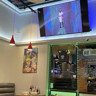 Naruto ramen poster and Naruto playing on TV