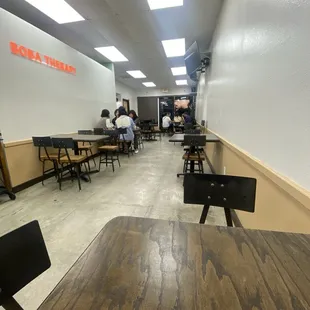 Tables inside, about 8 tables each sit between 2-4.