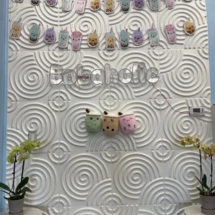 a wall with a bunch of teddy bears on it