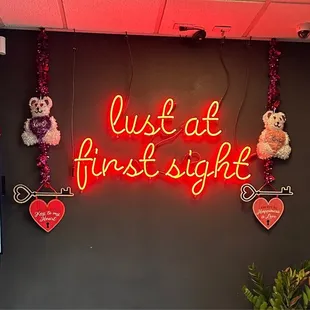 a neon sign that says just at first sight