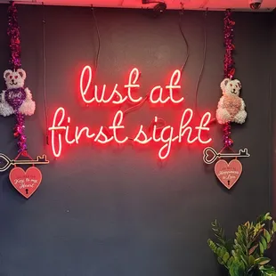 a neon sign that says just at first sight