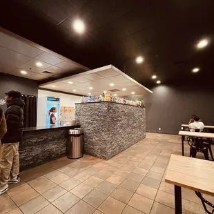 a man standing in front of a counter