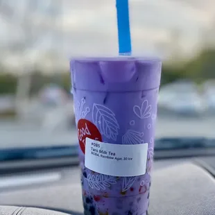 a plastic cup with a blue straw