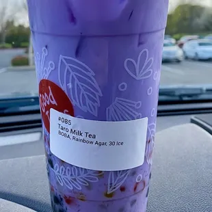 a plastic cup with a blue straw