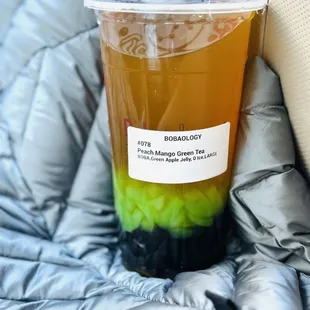 a plastic cup of bubble tea