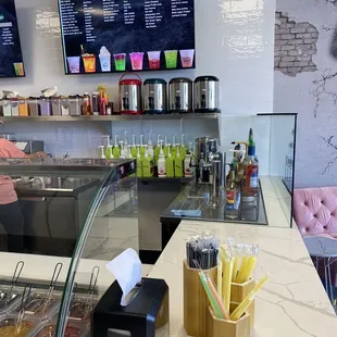 Syrups teas menu and straw area.