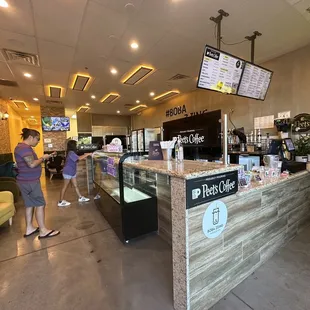 a woman standing at the counter