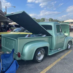a pick up truck with its hood open