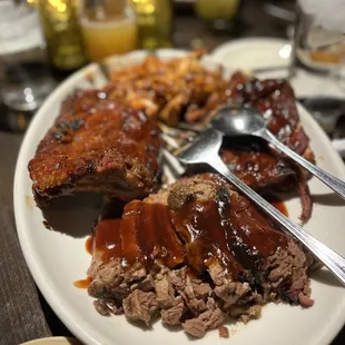 a plate of ribs and sides