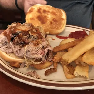 Pork sandwich and steak fries