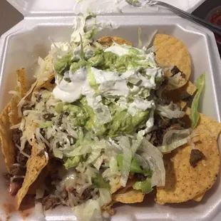 Super nachos! Carne Asada, beans, cheese, lettuce, guac and sour cream. I asked for the salsa on the side