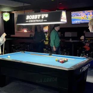 people playing pool