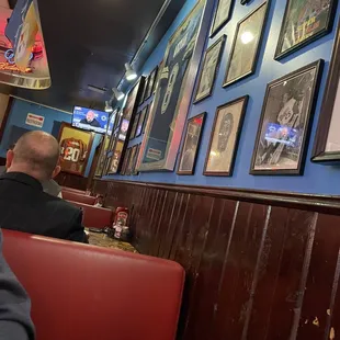 a man sitting in a booth