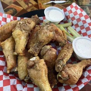 Lemon pepper 12 Piece Classic Wings served with two ranches and a side of celery