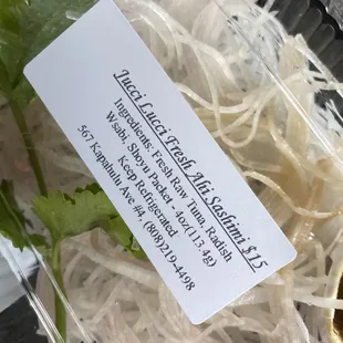a plastic container of noodles