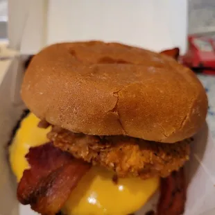 Cold rubbery  bacon on heated up frozen patty